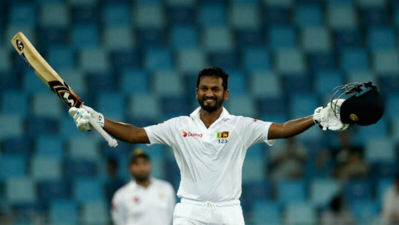Dimuth Karunaratne acknowledges the crowd after reaching three figures  &copy; Getty Images