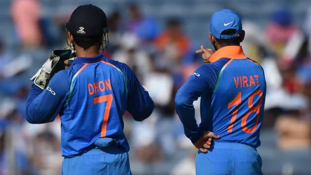 Dhoni and Kohli's bromance on the field is well known © AFP