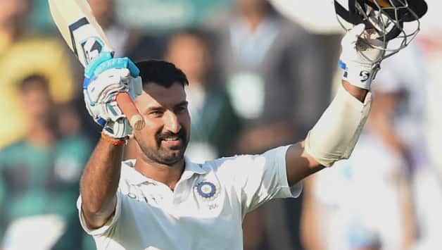 This was Pujara's 14th Test ton © AFP