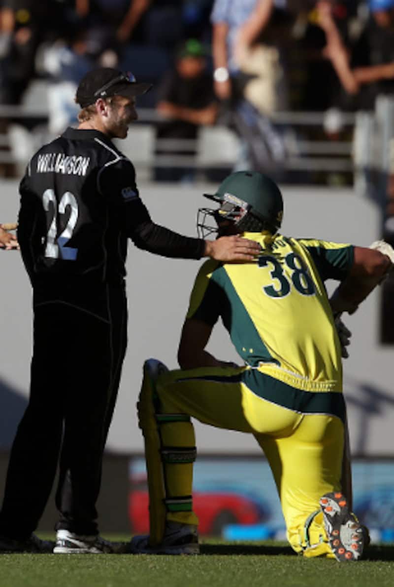 Kane Williamson commiserates Josh Hazlewood after running him out at Auckland &copy; AFP 