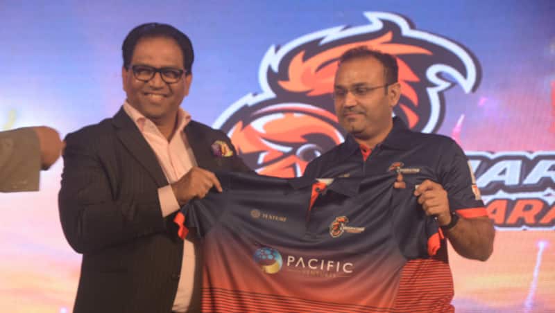 Virender Sehwag with one of the team owners during the launch of Maratha Arabians' jersey &Acirc;&copy; Maratha Arabians
