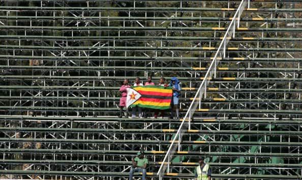 Zimbabwe fans holding the flag during a match © Getty Images