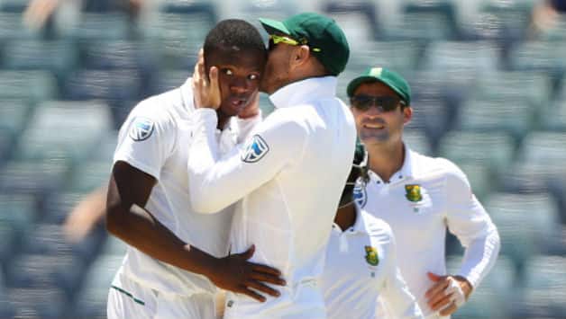 Faf du Plessis plants a history-defying kiss on Kagiso Rabada © Getty Images