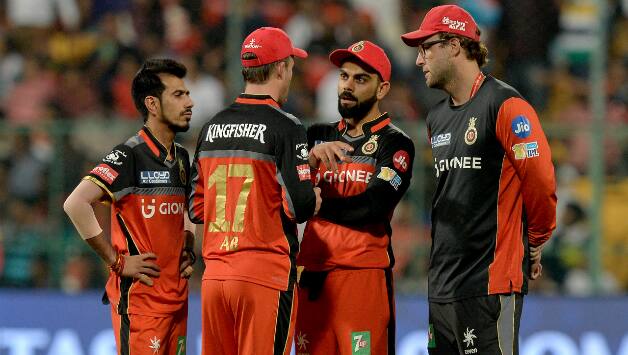 Yuzvendra Chahal, Virat Kohli and Daniel Vettori © AFP