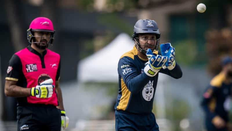 Nizakat Khan (left) and Kumar Sangakkara won the Man of the Match (final) and Man of the Tournament respectively © Ike Li / Ike Images