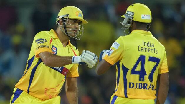 MS Dhoni with Dywane Bravo (file photo) © IANS