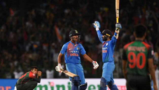 Dinesh Karthik (second right). © AFP
