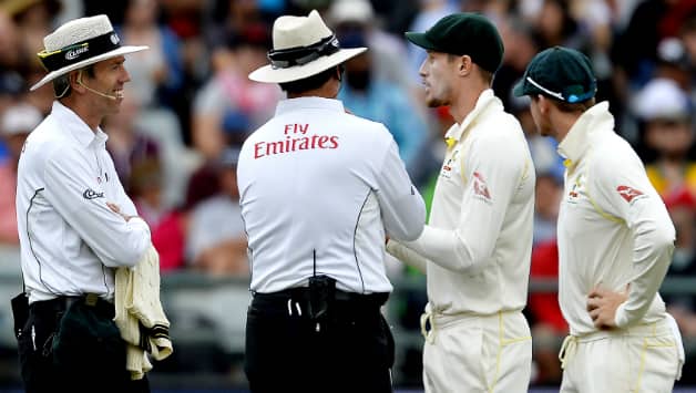 Cameron Bancroft and Steven Smith fight it out with the umpires after being caught tampering the ball © Getty Images