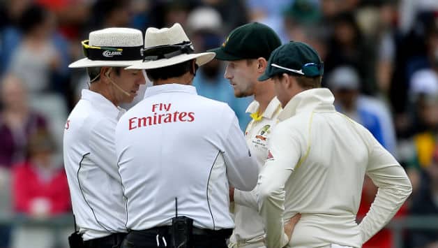 Cameron Bancroft (second from right) and Steven Smith © Getty Images
