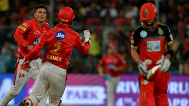 Mujeeb Zadran celebrates the wicket of Virat Kohli © AFP