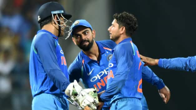 MS Dhoni, Virat Kohli, Kuldeep Yadav © AFP