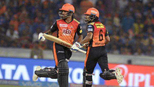 Shikhar Dhawan (L) and Wriddhiman Saha add 62 for the first wicket © AFP