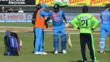 MS dhoni brings drinks for Suresh Raina during 2nd T20I against Ireland