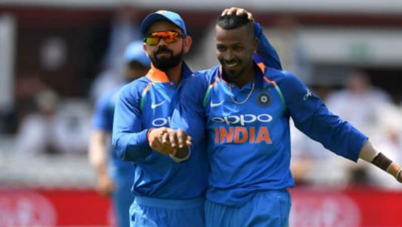 Hardik Pandya of India celebrates with Virat Kohli