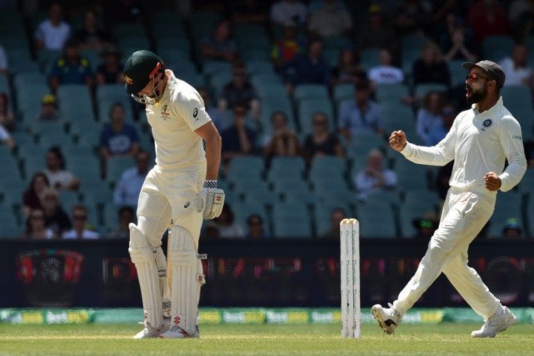 Virat Kohli celebrates the wicket of Shaun Marsh for 60.