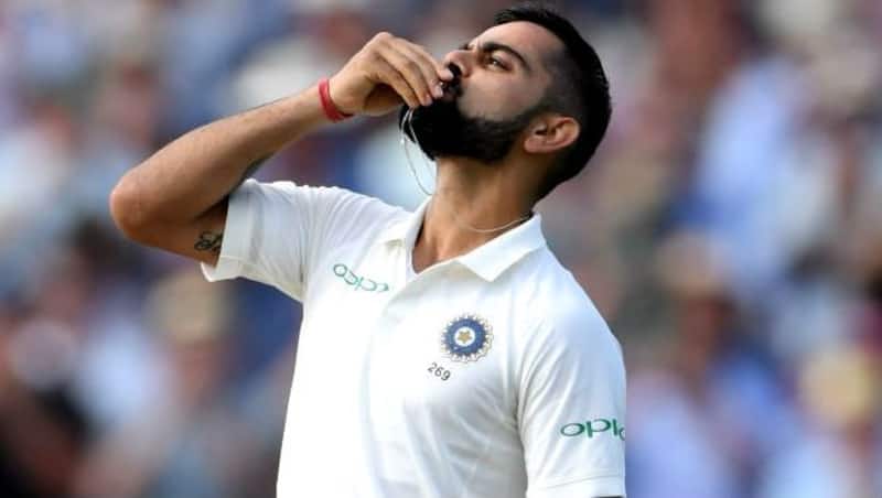 Virat Kohli celebrates his century by kissing his wedding ring
