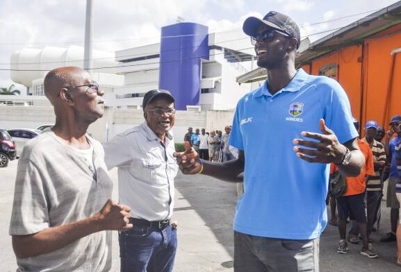 Jason Holder interacts with fans at Kensington Oval.