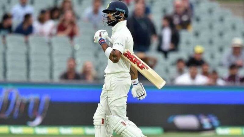 Virat Kohli was given a mixed reception when he came to bat after the fall of opener Mayank Agarwal with the Indians fans chanting his name, while some of Australia's fans booing the star batsman. @ AFP