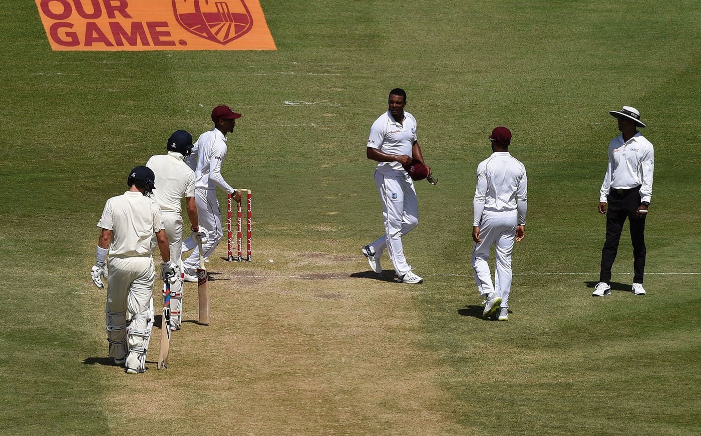 Shannon Gabriel and Joe Root during the St Lucia Test.