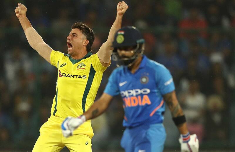 Marcus Stoinis celebrates getting Virat Kohli for 20.