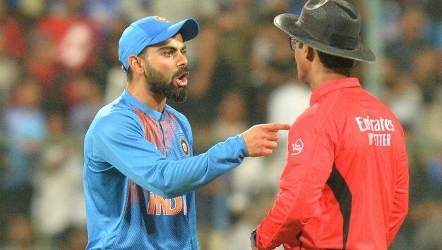 बेंगलुरू टी20 के दौरान अंपयार से बात करते भारतीय कप्तान विराट कोहली (IANS)