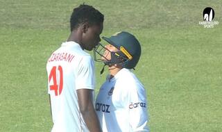 zim vs ban zimbabwe in frustration blessing muzarabani put his head on taskin ahmed s helmet for sledging watch video goes viral