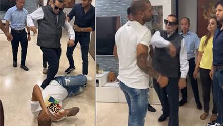 shikhar dhawan posted a hillarious video of his father beating him harbhajan singh shines with epic reply