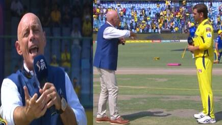 Danny Morrison uses sign language with ms dhoni after loud cheers in stadium