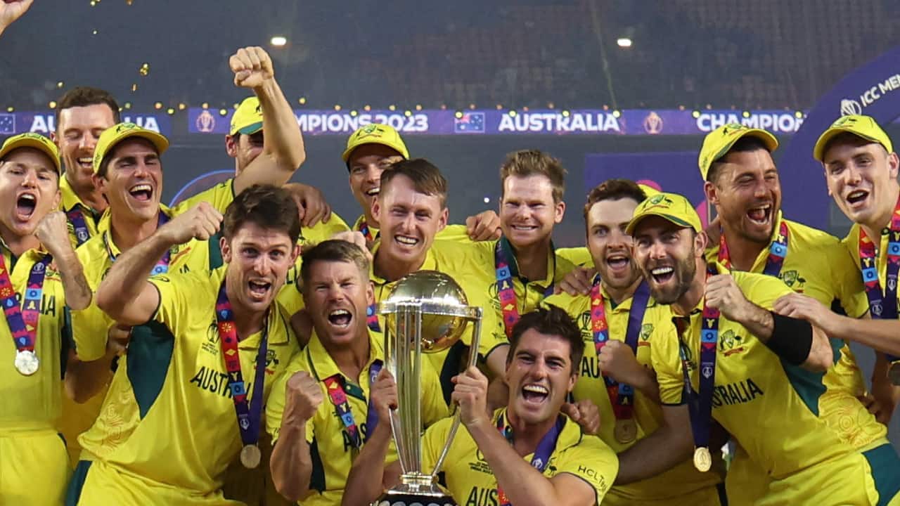 Australian team celebrating with the 2023 ODI WC trophy