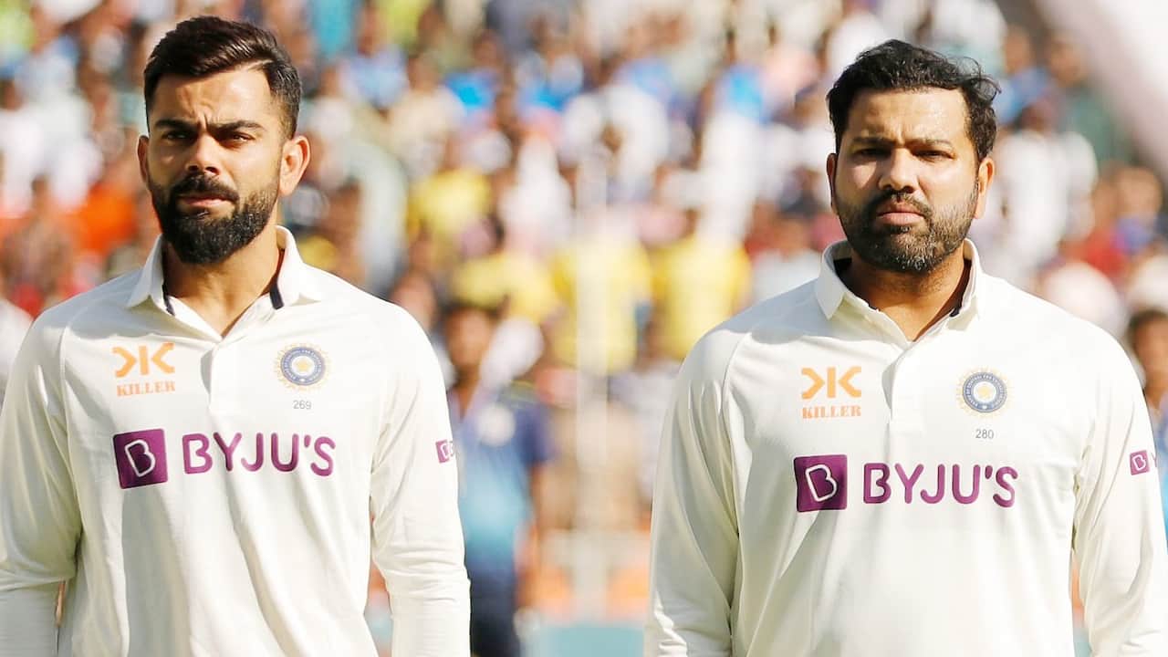Rohit and Virat standing together during a Test match