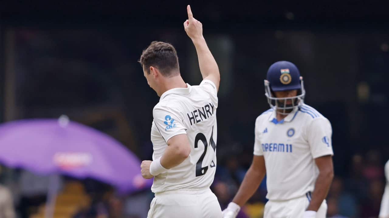 Henry taking a wicket against India