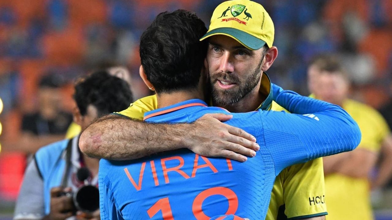 Kohli and Maxwell hugging each other