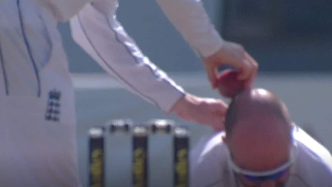Root rubbing the ball on Leach's head