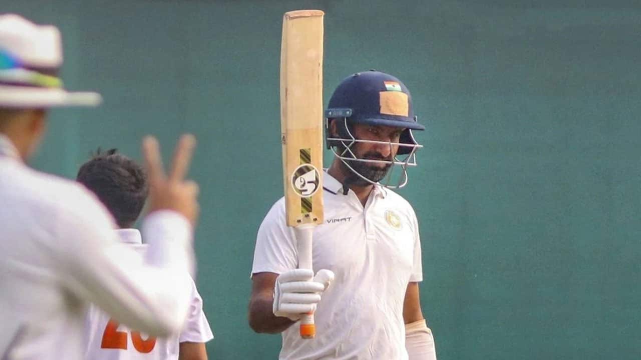 Pujara scoring a ton during a Test match