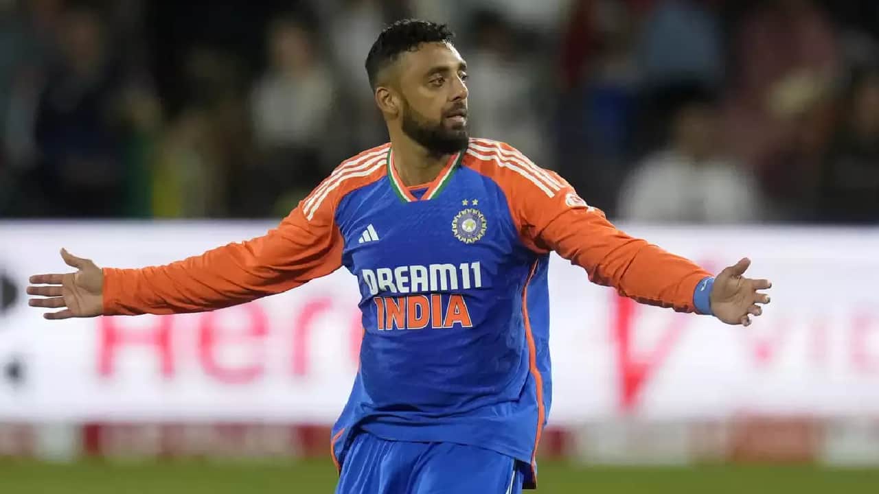 Chakravarthy taking a wicket during a T20I