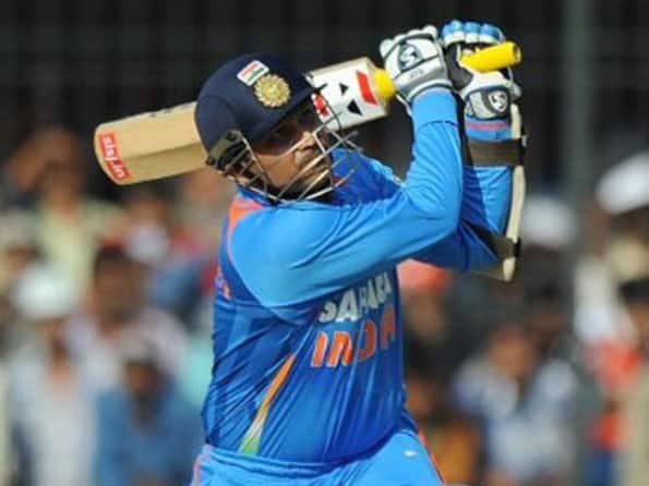 Sehwag was humming Kishore Kumar songs during double ton: Raina
