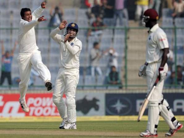 Ojha bags six wickets to restrict West Indies for 304 Ojha bags six wickets to restrict West Indies for 304