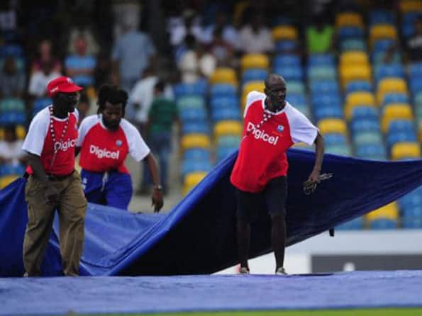 Rain spoils second day's play after India tighten noose 