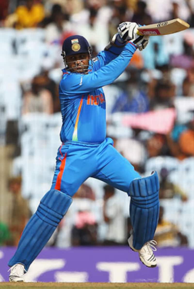Sehwag reaches half-century after Tendulkar's unfortunate run out