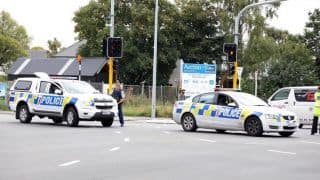 Police officers cordon a street near the mosque after a firing incident in Christchurch.